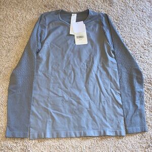 Fabletics long sleeve workout top, size small, grey. Never been worn.